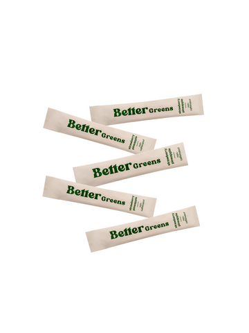 Five BetterGreens stick packets labeled strawberry pineapple on a white background.
