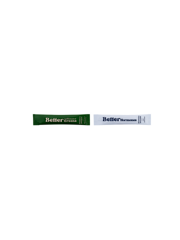 Two single-serve stick packs labeled “Better Greens” (green) and “Better Hormones” (white) on a white background.