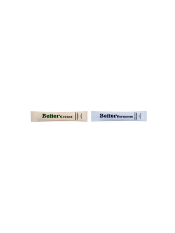 Two single-serve supplement packets labeled “Better Greens” and “Better Hormones” on a white background.