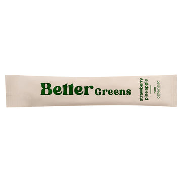 Single-serve packet labeled “BetterGreens”; text on right: “strawberry pineapple” and “non-caffeinated”.