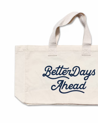 Beige tote bag with 'Better Days Ahead' text in navy on a white background
