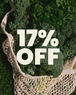 Mesh shopping bag with vegetables and '17% OFF' text overlay on a green leafy background