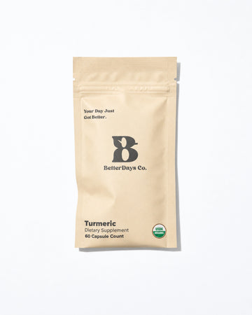 A beige stand-up pouch of BetterDays Co. Turmeric dietary supplement, 60 capsule count, with a small green USDA Organic seal on the lower right, set against a clean white background.