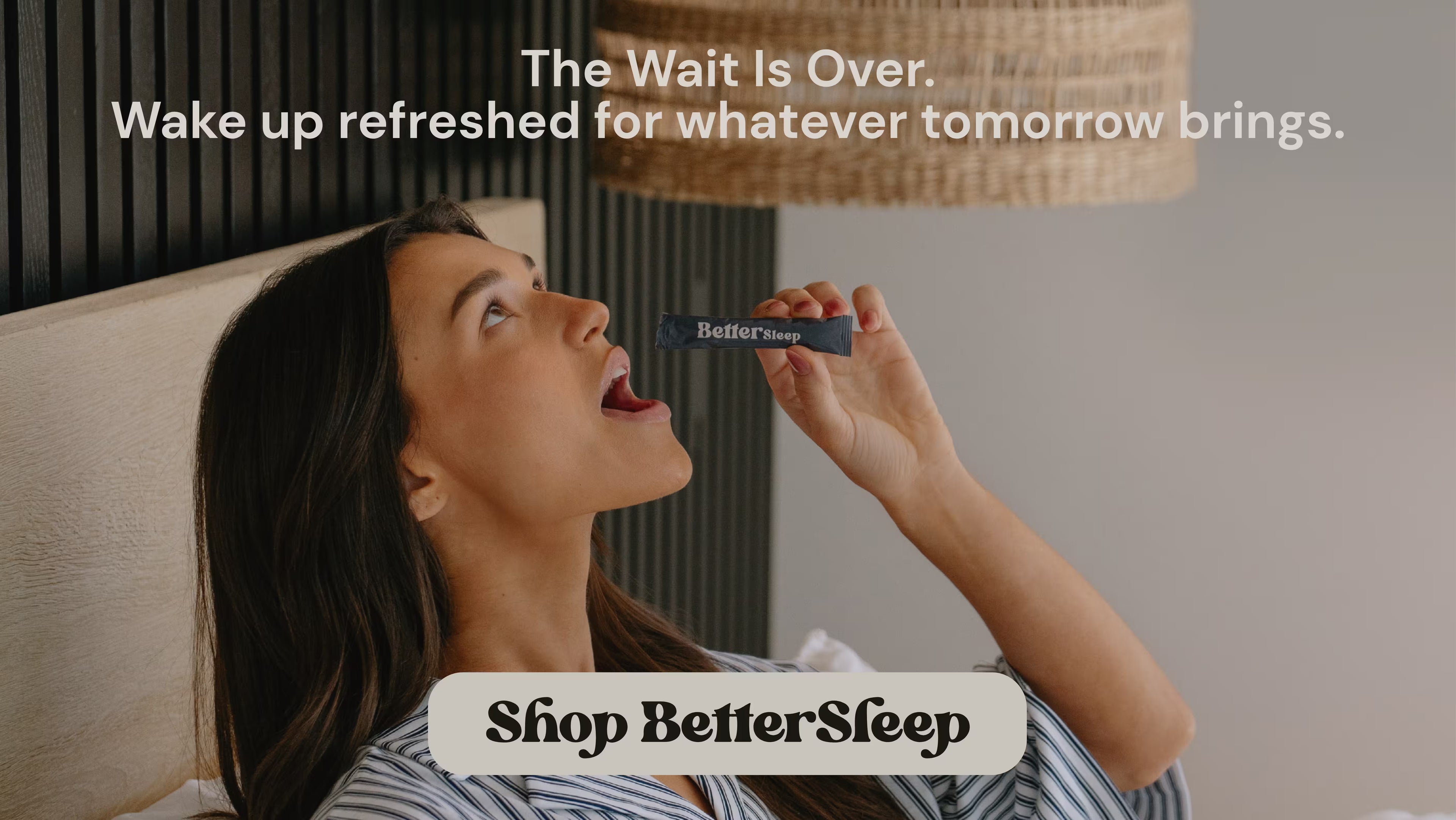A woman lying in bed wakes up holding a BetterSleep pill bottle, with promotional text reading 'The Wait Is Over. Wake up refreshed for whatever tomorrow brings.