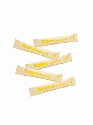 Five beige “Better Hydration” stick packets with yellow text on a white background.